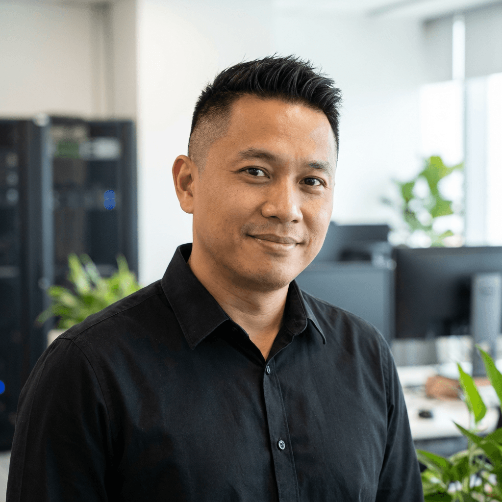 Marcus Chen standing in a modern office hallway